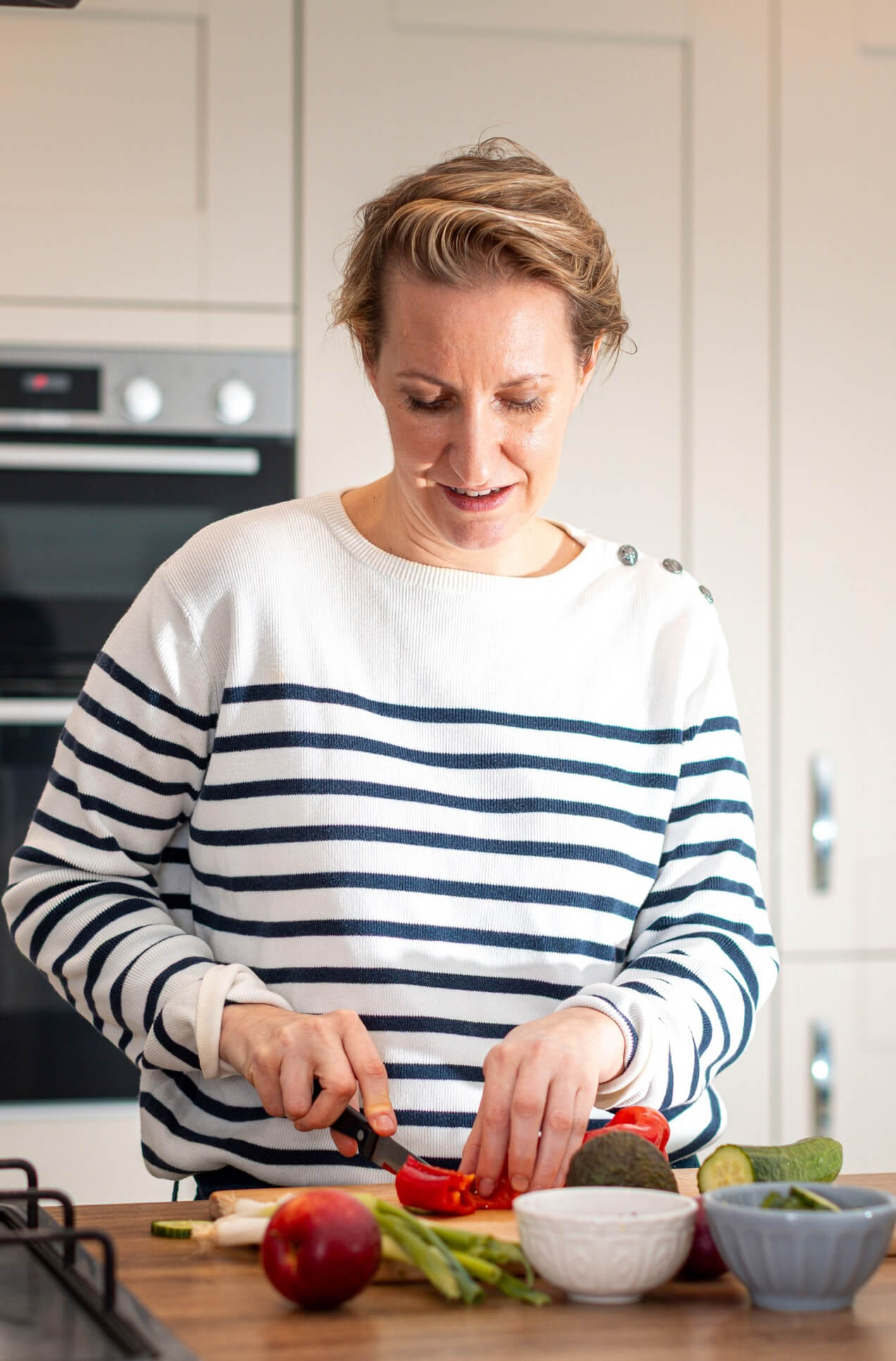 Domitille in her kitchen, preparing healthy meals